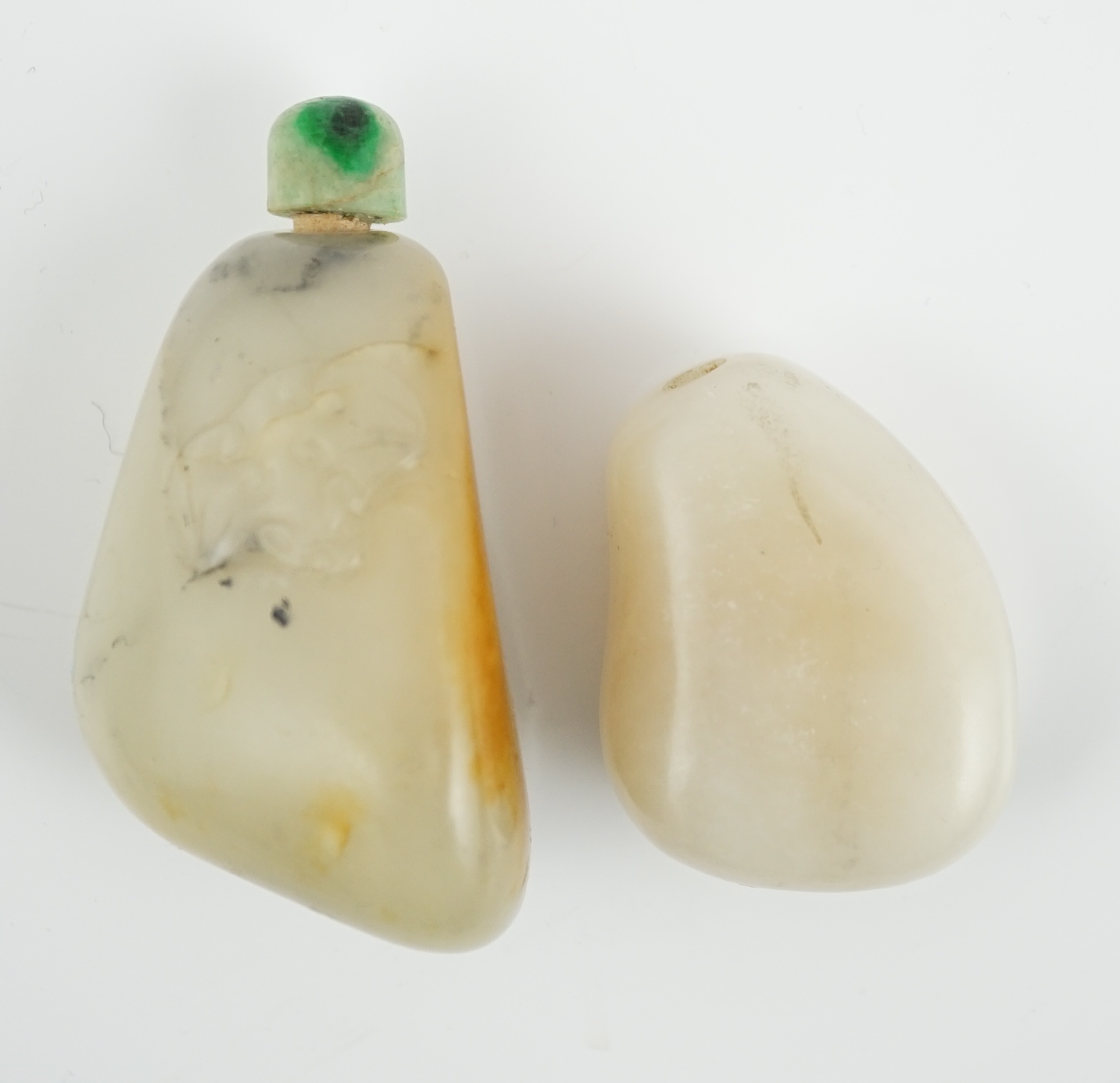 Two Chinese jade pebble snuff bottles, 19th century